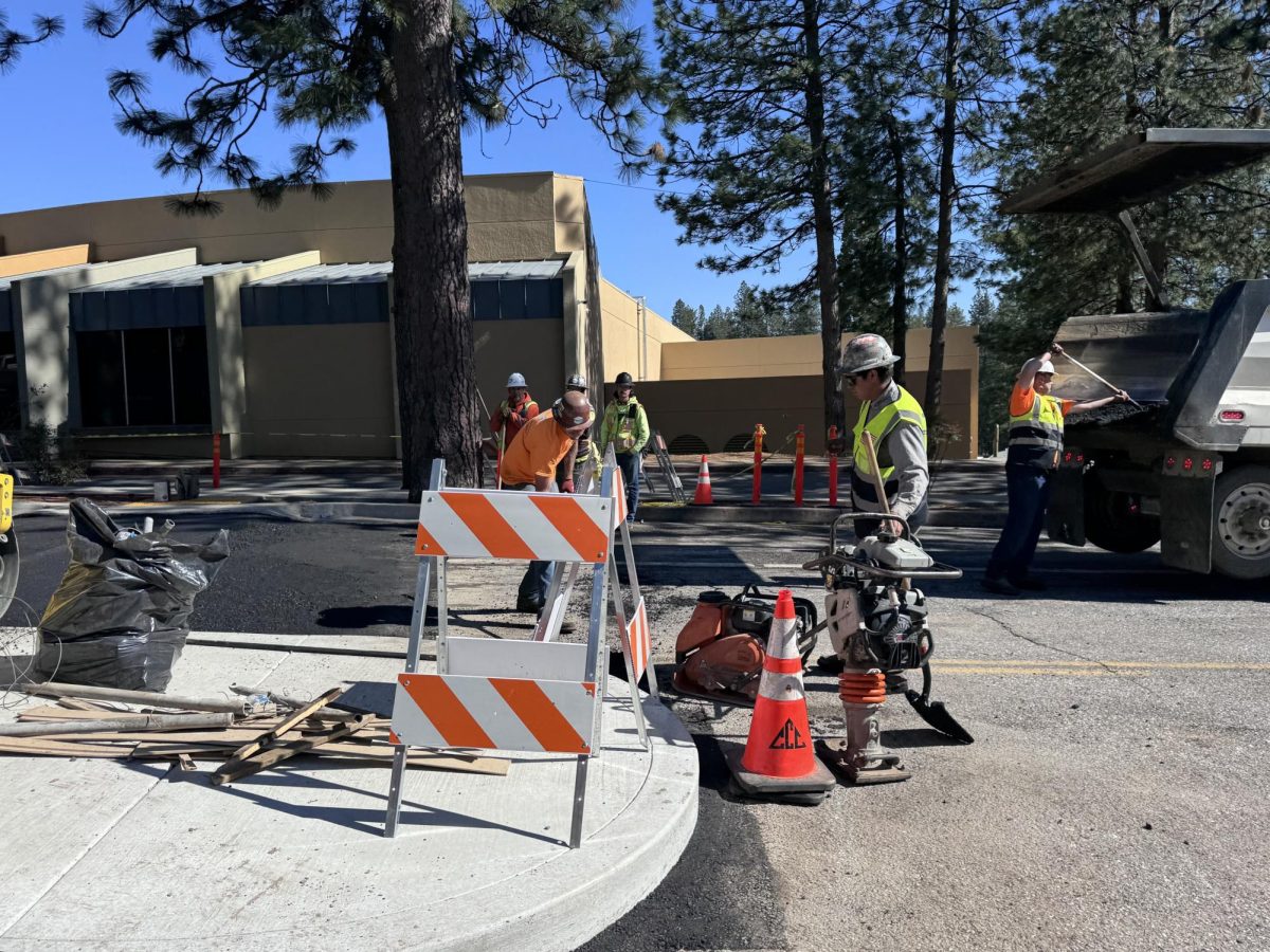 Construction workers install the new crosswalk on Ridge road, on April 8th